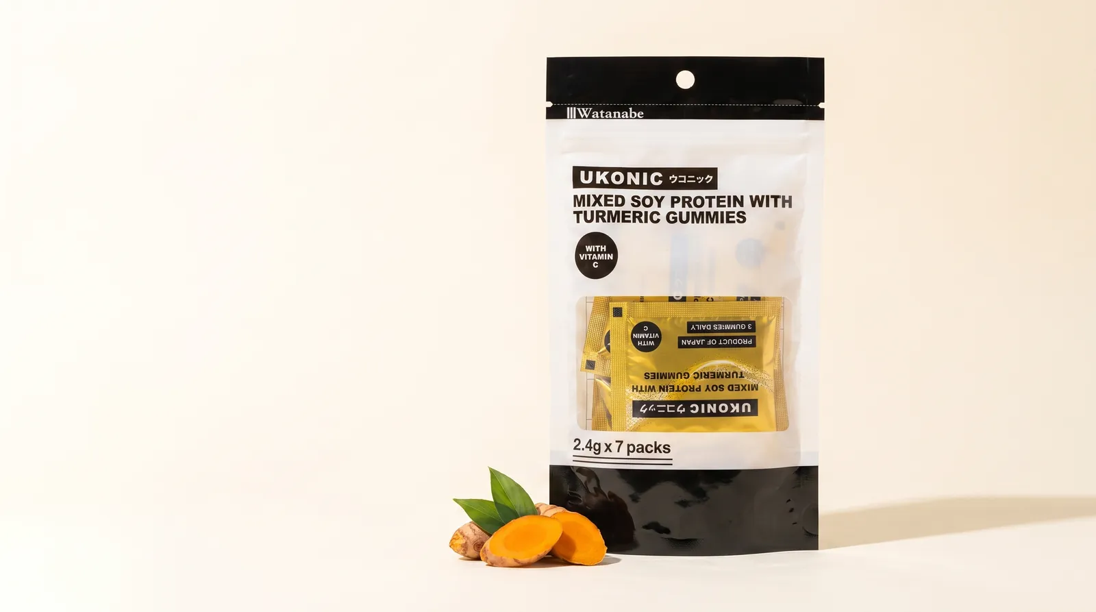 UKONIC turmeric gummies pouch with a gold single-serve sachet and fresh turmeric root