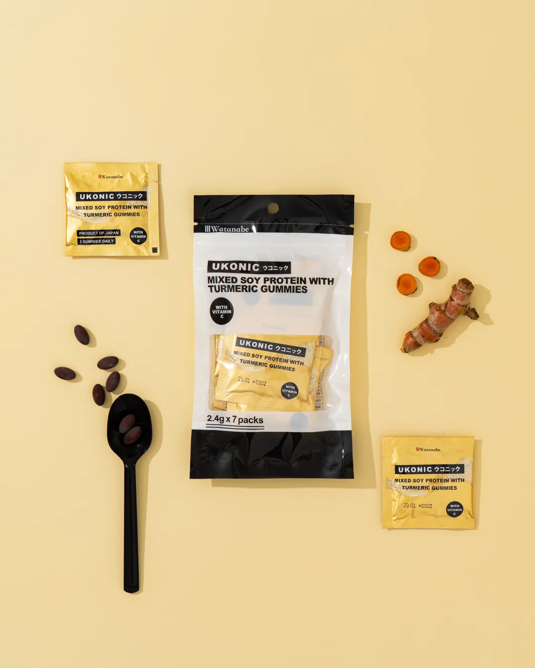 Top view of the UKONIC pouch with single-serve sachets, turmeric softgels and fresh turmeric